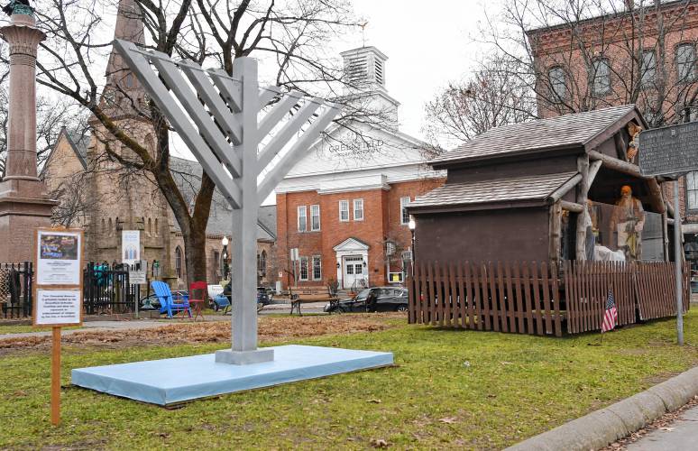 A Hanukkah menorah has been erected next to the creche on the Greenfield Common.