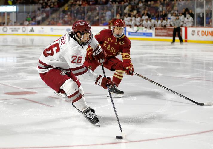 UMass defender Owen Murray (26) takes possession from Boston College’s Colby Ambrosio (11) in the second period Friday night at the Mullins Center.