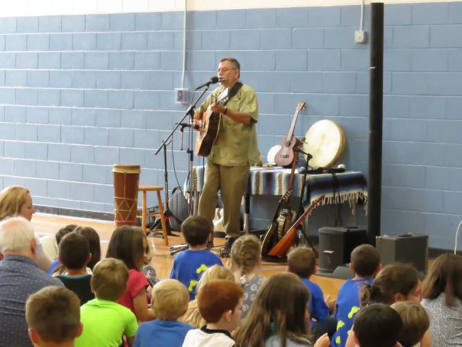 Roger Tincknell, one of the recipients of funding from the Montague Cultural Council, performs at Northfield Elementary School in 2023.