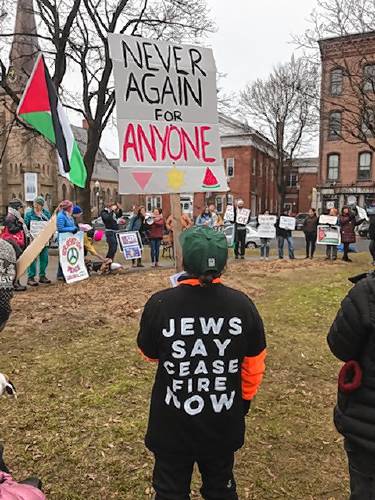 Residents participate in the weekly peace gathering on the Greenfield Common. Local organizers and activists are planning to bring forward a resolution calling for a cease-fire in Gaza to the Greenfield City Council as early as the body’s March meeting.