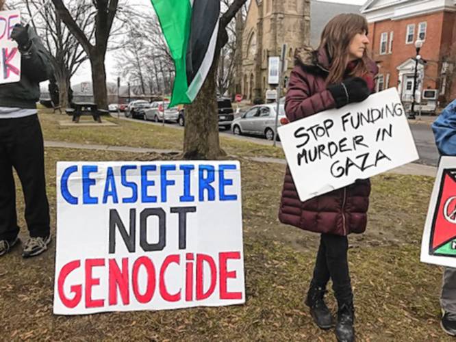 Residents participate in the weekly peace gathering on the Greenfield Common. Local organizers and activists are planning to bring forward a resolution calling for a cease-fire in Gaza to the Greenfield City Council as early as the body’s March meeting.