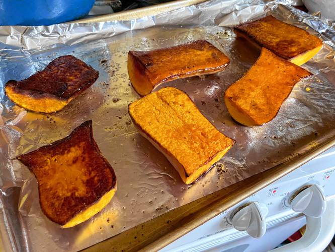 The skin of the Honeynut is edible if you eat the squash straight from the oven, but I thought it would be hard to pulverize the skin, which the heat had rendered crunchy. So I scooped the squash out of the skin after I baked it. (I did snack on a few morsels of skin.)