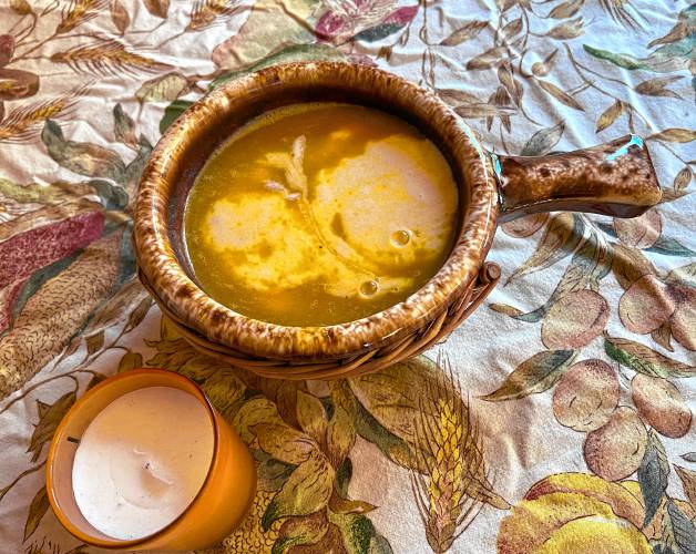 This soup features a cider and cream reduction. You may either stir the reduction into the soup and serve it or put the reduction into a pitcher and let your guests drizzle it into the soup at the table. Either way, it’s delicious.