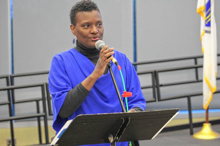 Marcia Gomes sings a song before a reveal event detailing the findings of the 2023 research report on gender equity that was prepared by the Public Health Institute of Western Massachusetts. The event was held at Greenfield Community College on Wednesday.