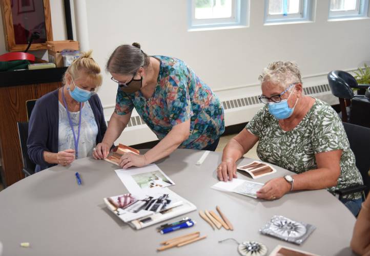 Retired art teacher and Leyden resident Ginny Rockwood, center, teaches a class at the Northfield Senior Center in 2022. At left is Senior Center Director Colleen Letourneau and Pam Eldridge is on the right. Rockwood will teach a class on the blotted line technique at the center on Tuesday, Feb. 13.