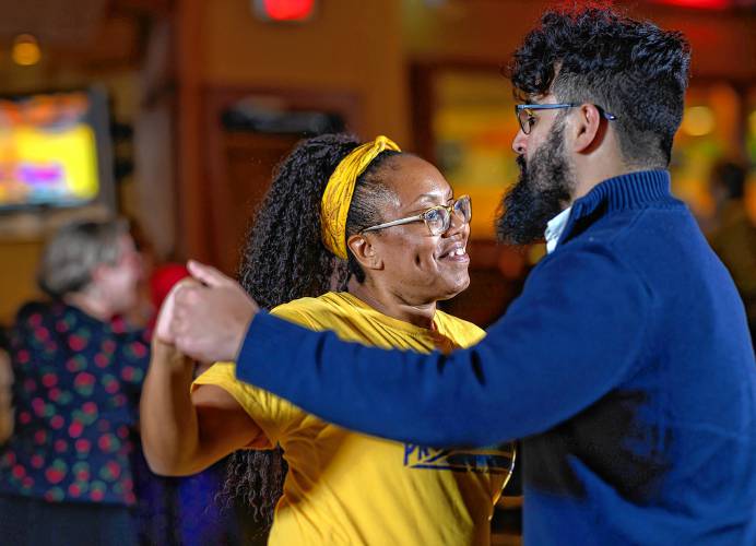 Amherst resident Marita Banda, left, dances with Northampton resident Josue San Emeterio during a weekly swing dance organized by the Lindy League of Western Massachusetts.