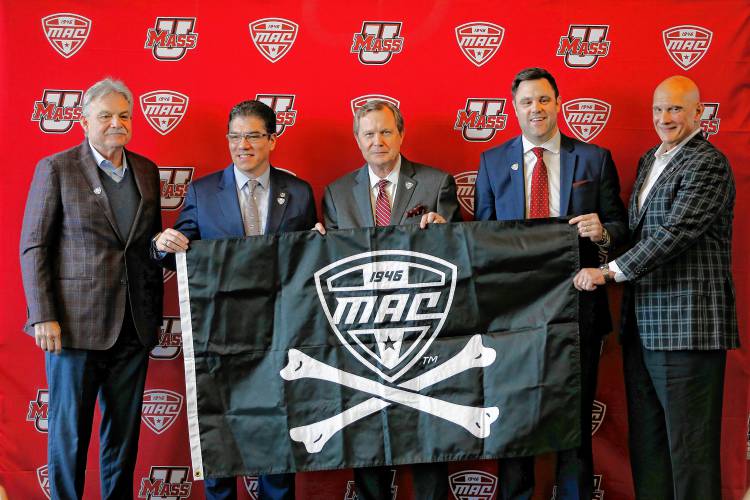 UMass football head coach Don Brown, from left, Chancellor Javier Reyes, MAC commissioner Dr. Jon Steinbrecher, Director of Athletics Ryan Bamford and men’s basketball head coach Frank Martin during a press conference at the Martin Jacobson Football Performance Center on Thursday regarding the University of Massachusetts joining the Mid-American Conference.