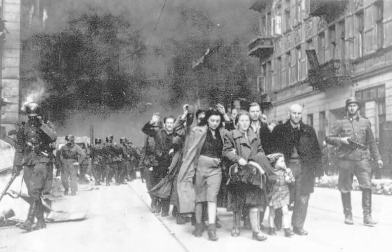 In this 1943 file photo, a group of Polish Jews are led away for deportation by German SS soldiers during the destruction of the Warsaw Ghetto by German troops after an uprising in the Jewish quarter ghetto by German soldiers on April 19, 1943.