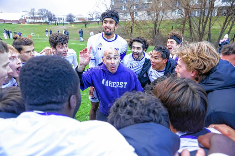Amherst College men’s soccer coach Justin Serpone talks to his team earlier this season. The Mammoths will play in the NCAA Division 3 Final Four on Friday against Washington and Lee.