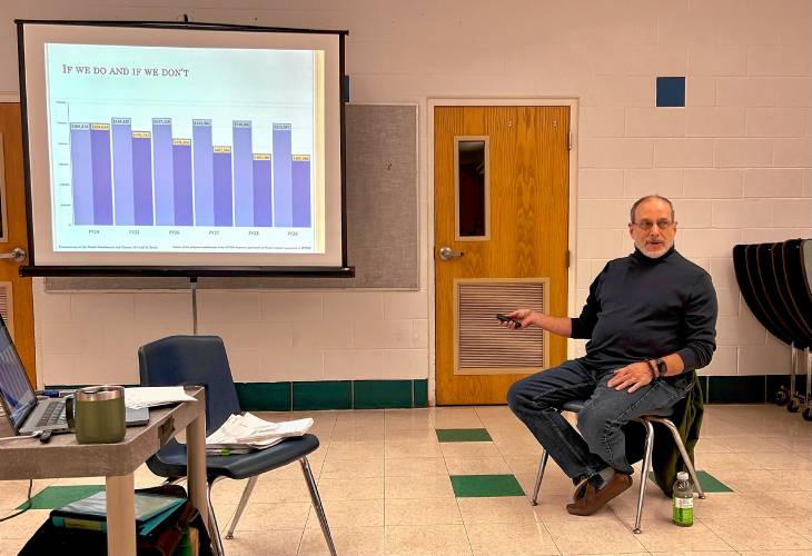 Ken Rocke, a Heath resident with a background in public education, gives a presentation about how a proposed change to the Mohawk Trail Regional School District’s town assessment formula could impact Heath.
