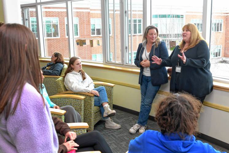 State Reps. Natalie Blais and Susannah Whipps talk to students in the Greenfield High School library during the YELO (Youth Engage with Legislators and Officials) forum on Thursday. 