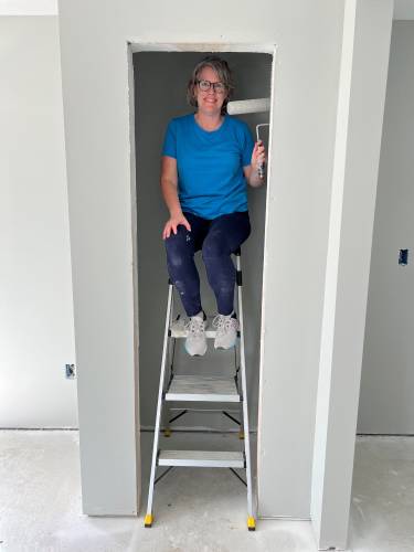 Jane Wolfe of Greenfield Cooperative Bank recently volunteered to help paint a Pioneer Valley Habitat for Humanity house.
