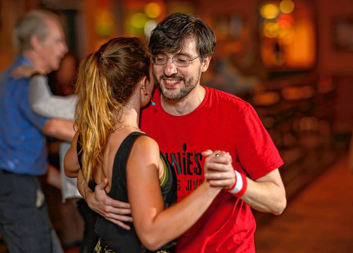 Matt Scott of Wethersfield, Connecticut, dances with Anna Leschen-Lindell of Montague during a weekly swing dance organized by the Lindy League of Western Massachusetts at Spare Time Northampton and City Sports Grille.
