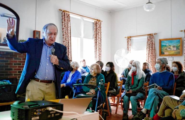 Dave Palmer gives a historical talk for the dozens of community members gathered at Leverett Town Hall during the town’s 250th anniversary celebrations on Saturday.