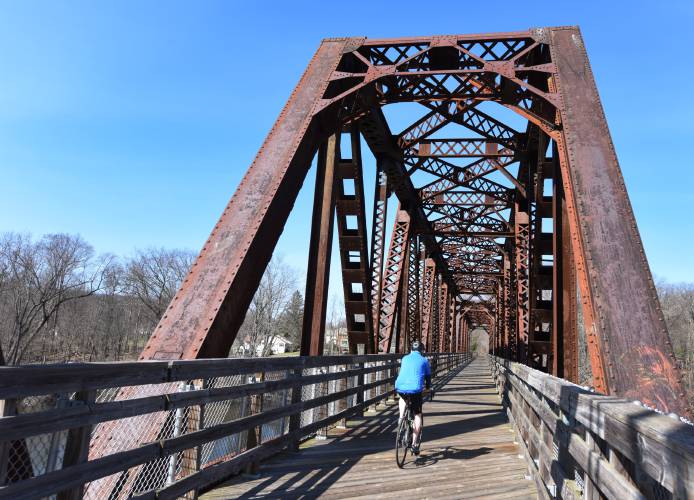 A lone bicyclist crosses the Connecticut River from Deerfield into Montague in 2020. The Franklin Regional Council of Governments is asking the public to complete an online survey with an interactive mapping component to provide information for an updated Franklin County Bike Plan.