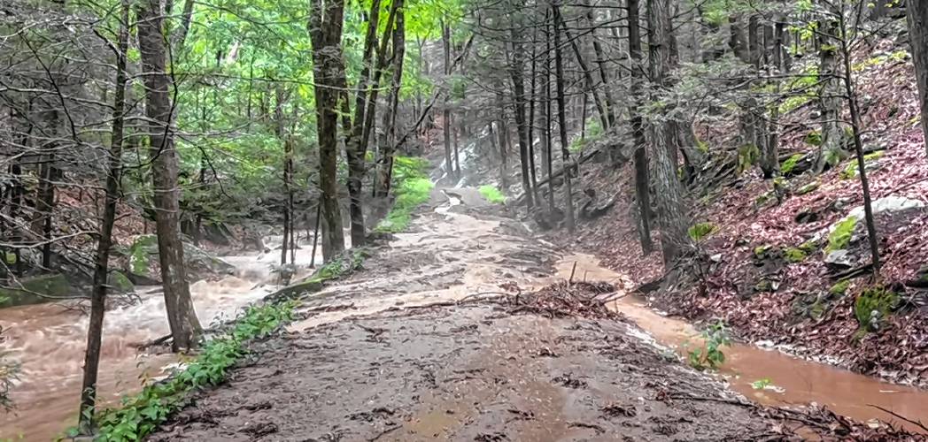 A still image from a video recorded by Eva Gibavic in July shows the damage to Rattlesnake Gutter Road caused by the summer’s wet weather. The town must decide whether to keep maintaining the closed portion of the road that provides access to popular recreation areas.