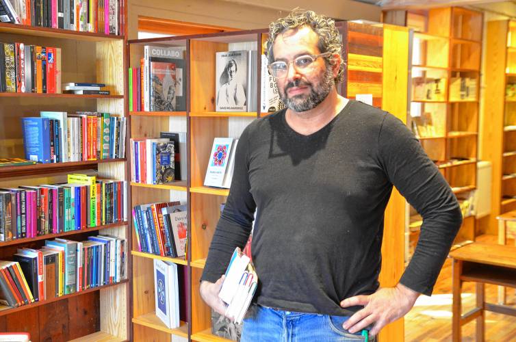 Co-owner Adam Tobin at Unnameable Books on Avenue A in Turners Falls.