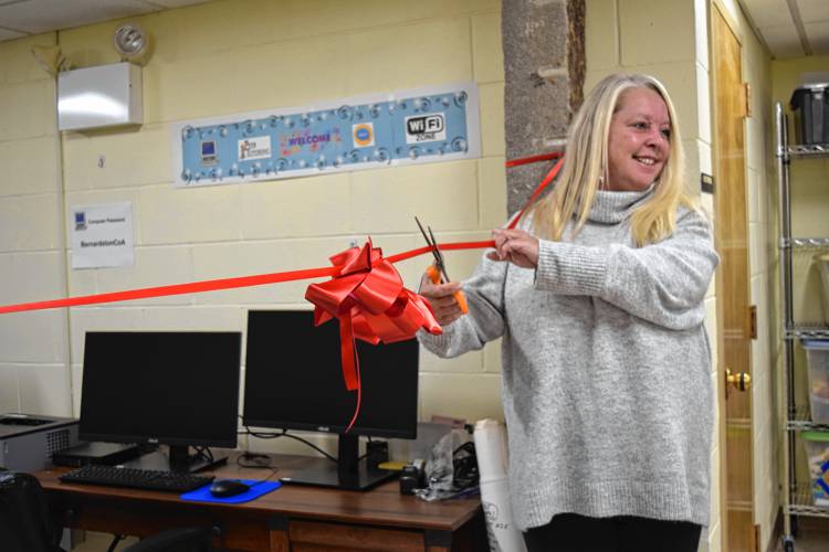 Bernardston Senior Center Director Jennifer Reynolds cuts a ribbon on Tuesday to celebrate the center’s new computer lab.