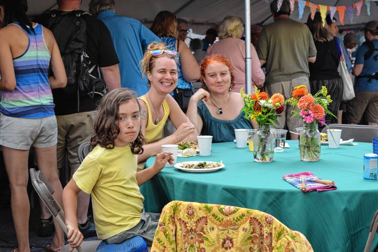 Visitors attend the 18th annual Harvest Supper on the Greenfield Common on Saturday.