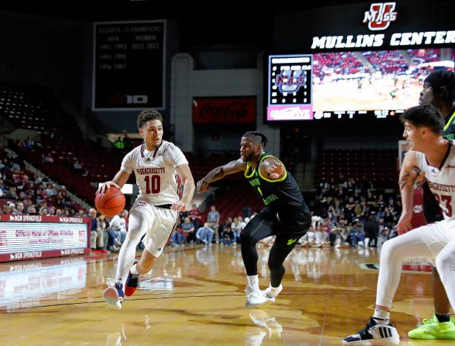 UMass guard Marqui Worthy (10) drives the ball against South Florida’s Selton Miguel (1) in the second half Saturday at the Mullins Center in Amherst.