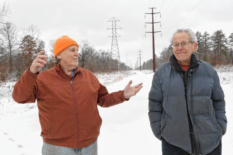 Sam Lovejoy and Dan Keller stand at the Montague Plains where, 50 years ago, Lovejoy toppled a weather tower being used to collect data for a proposed nuclear power plant. Wendell drove Lovejoy to the area of the site in the middle of the night on Feb. 22, 1974, and chronicled the event and ensuing court case in the one-hour documentary film “Lovejoy’s Nuclear War” the following year. The film will be shown at the Shea Theater Arts Center on the 50th anniversary of the event.