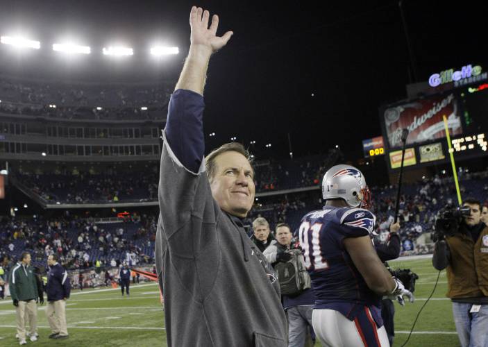 FILE - New England Patriots coach Bill Belichick waves to fans after the Patriots beat the New York Jets 31-14 in an NFL football game in Foxborough, Mass., Sunday Nov. 22, 2009. Six-time NFL champion Bill Belichick has agreed to part ways as the coach of the New England Patriots on Thursday, Jan. 11, 2024, bringing an end to his 24-year tenure as the architect of the most decorated dynasty of the league’s Super Bowl era, a source told the Associated Press on the condition of...