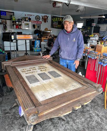 U.S. Army veteran and woodworker Bernie Ramirez, pictured in his garage in Hollister, California, will restore this World War II memorial purchased by Jim Gillio. The memorial will then be returned to its rightful home in Wendell, Massachusetts.