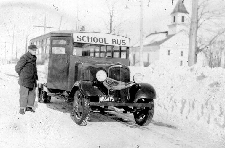 School bus driver Ray Clark stands ready to pick up students on a winter’s day. This 1935 photo is among those that can be viewed at the Wendell Historical Society’s new online museum.