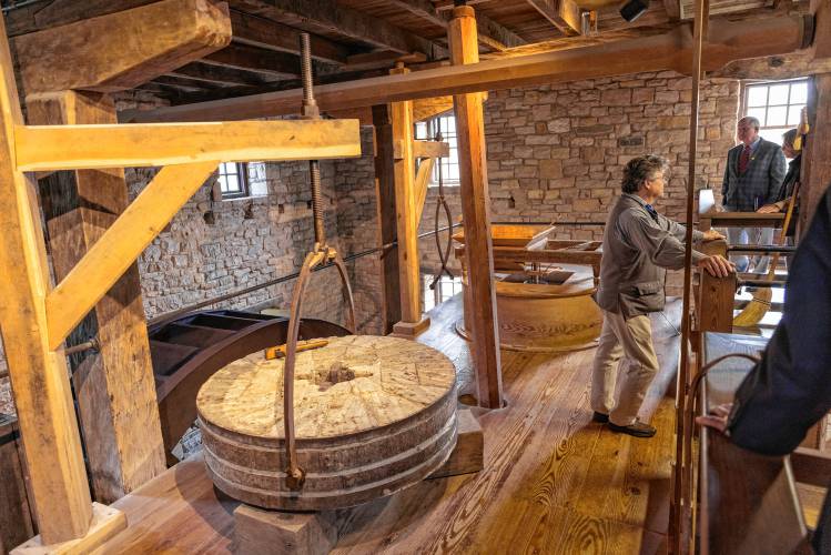 Tourists visit the reconstructed George Washington gristmill.