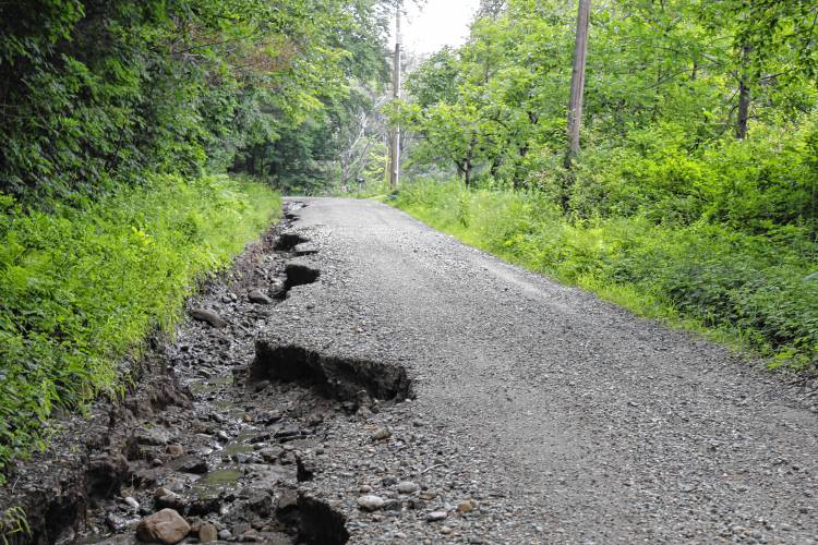 Rain and floodwater carved out large sections of Main Poland Road, Adams Road and other parts of Conway in July.