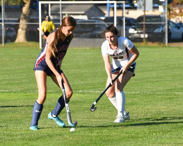 Mahar’s Taylor Paluk (5), left, carries the ball while defended by Northampton’s Jenna Talbot (22) during Valley League action on Monday in Northampton.