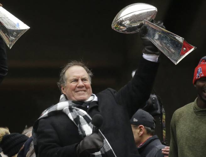 FILE - New England Patriots coach Bill Belichick holds up a Super Bowl trophy as he addresses the crowd during a rally Feb. 7, 2017, in Boston to celebrate the team's win over the Atlanta Falcons in the NFL Super Bowl 51 football game in Houston. Six-time NFL champion Bill Belichick has agreed to part ways as the coach of the New England Patriots on Thursday, Jan. 11, 2024, bringing an end to his 24-year tenure as the architect of the most decorated dynasty of the league’s Super...