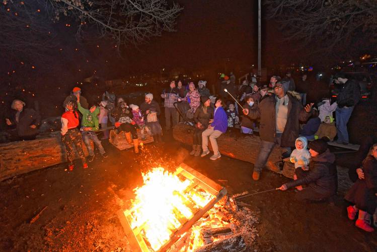 People enjoy the bonfire at Beacon Field Friday night during the 102nd annual Winter Carnival in Greenfield.