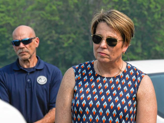 Gov. Maura Healey listens to farmers in the north meadows of Deerfield this summer about the recent flooding.