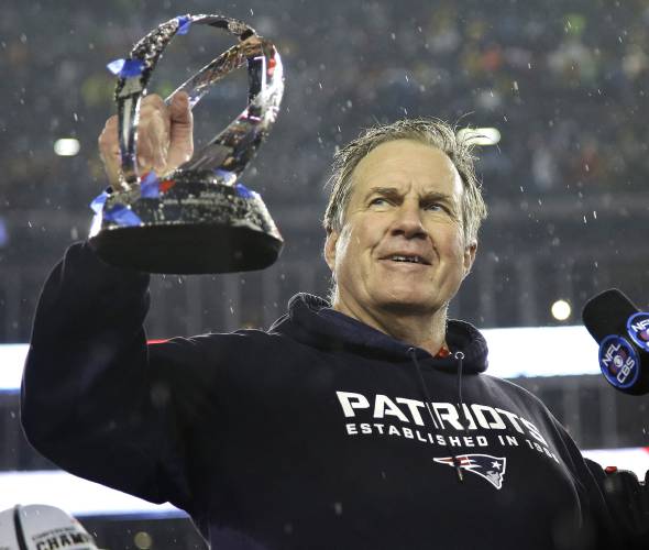 FILE - New England Patriots head coach Bill Belichick holds the championship trophy after the NFL football AFC Championship game Sunday, Jan. 18, 2015, in Foxborough, Mass. The Patriots defeated the Colts 45-7 to advance to the Super Bowl against the Seattle Seahawks. Six-time NFL champion Bill Belichick has agreed to part ways as the coach of the New England Patriots on Thursday, Jan. 11, 2024, bringing an end to his 24-year tenure as the architect of the most decorated dynasty of...