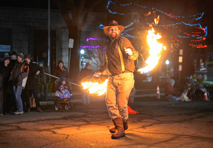 A fire dancer entertains at Court Square in Greenfield Friday night during the 102nd annual Winter Carnival. 