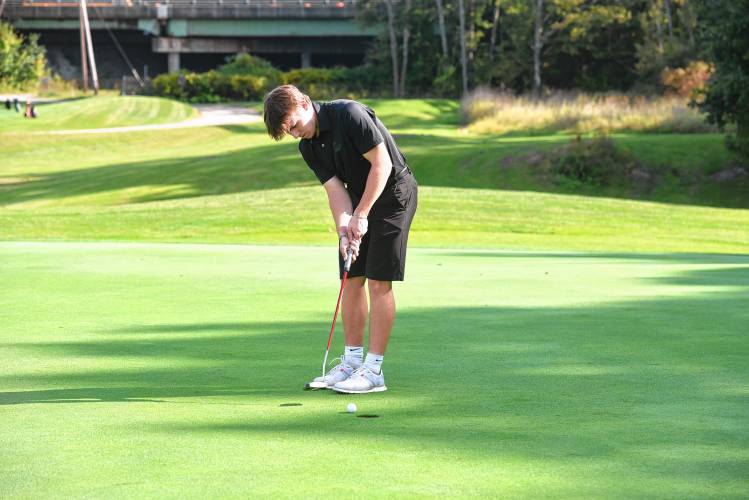 Greenfield’s Johnny Marchefka putts on Hole No. 2 during a match against Athol at the Country Club of Greenfield on Wednesday.