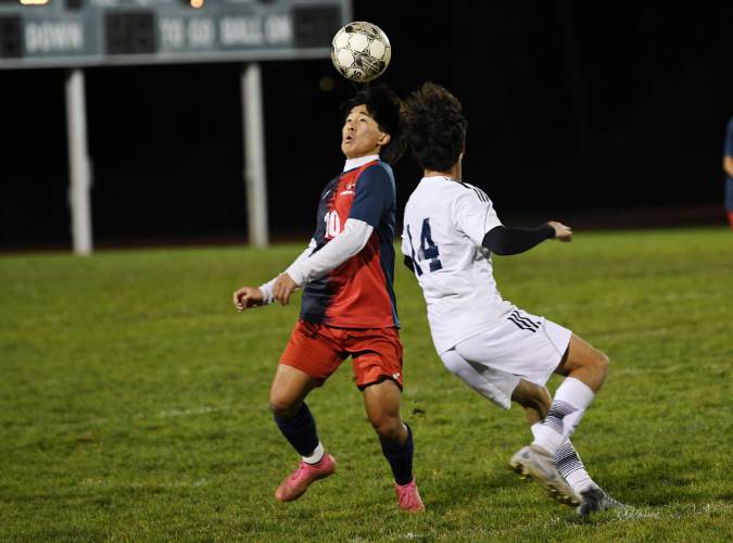 Frontier’s Chanhee Son heads the ball as Monomoy’s Braeden Darling defends in South Deerfield on Wednesday. 