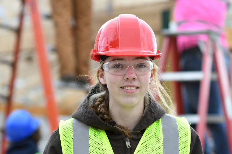Franklin County Technical School 11th grade carpentry student Kylee Gamache at the pavilion build in Shelburne Falls. “It feels nice working here. I’ve got a family that comes through here quite a bit and I can tell them, ‘Look, I built that,’” Gamache said.