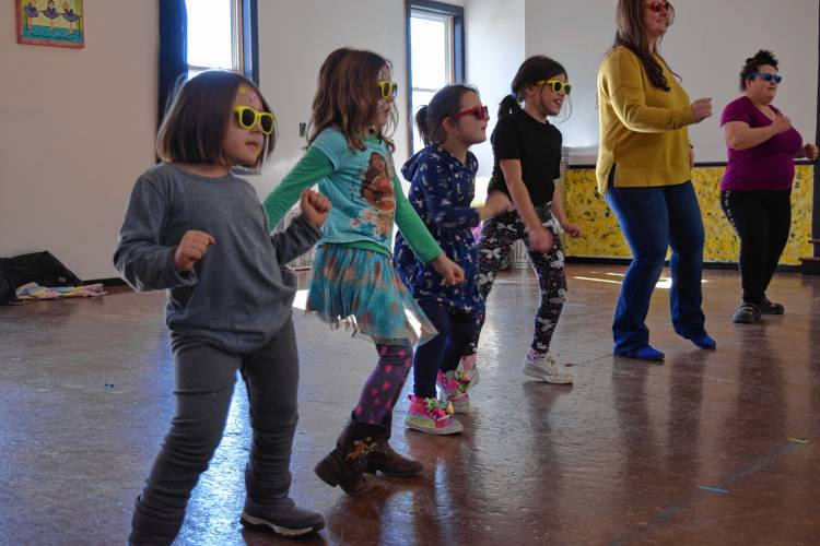 Children at Dawn’s School of Dance on Hope Street in Greenfield practice for the Sunday flash mob as part of the 102nd annual Winter Carnival.
