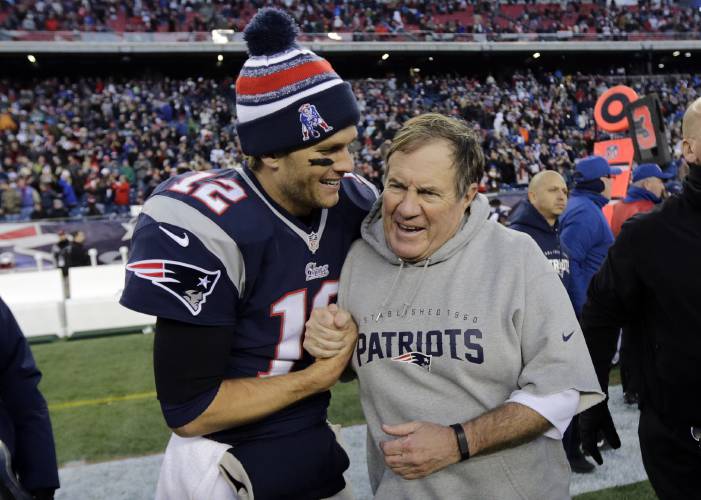 FILE - New England Patriots quarterback Tom Brady, left, celebrates with head coach Bill Belichick after defeating the Miami Dolphins 41-13 in an NFL football game Sunday, Dec. 14, 2014, in Foxborough, Mass. Six-time NFL champion Bill Belichick has agreed to part ways as the coach of the New England Patriots on Thursday, Jan. 11, 2024, bringing an end to his 24-year tenure as the architect of the most decorated dynasty of the league’s Super Bowl era, a source told the Associated...