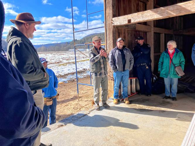 Greg Stevens, manager of Hamshaw Lumber in Greenfield, brought a donated window sash and transoms to the Wilder Homestead barn museum in Buckland on Feb. 12.