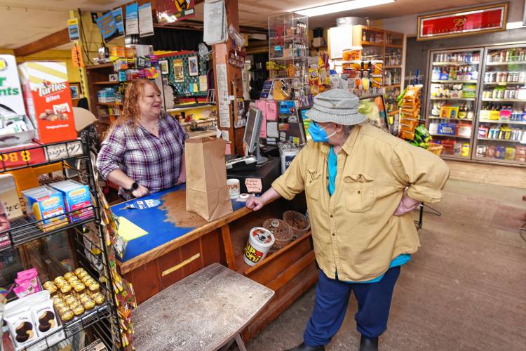 Wendell Country Store manager Audrey White talks with customer Kaymarion Raymond, of Wendell, at the store, which is celebrating 30 years under its current ownership.