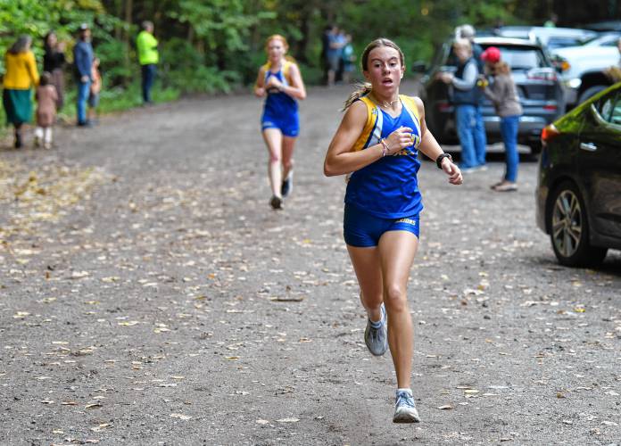 Mohawk Trail’s Virginia Krezmien crosses the finish line second overall at Highland Park on Tuesday afternoon. 