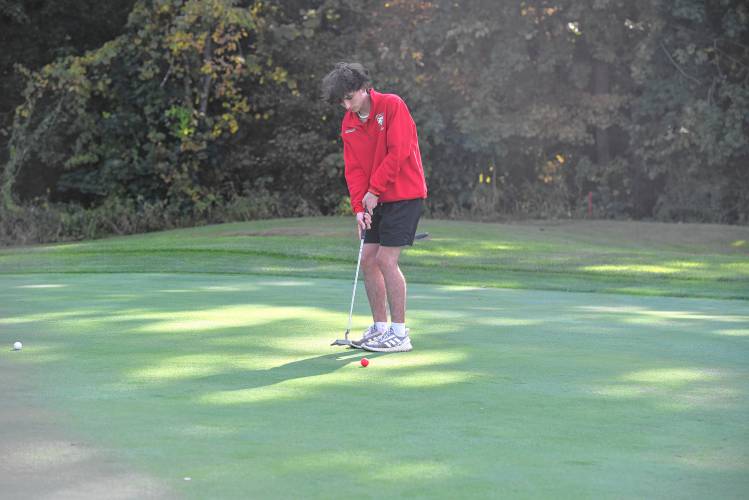 Athol’s Brandon Adams putts on Hole No. 2 during a match against Greenfield at the Country Club of Greenfield on Wednesday.