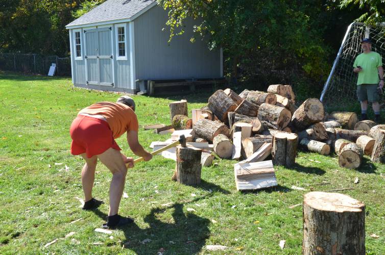 Conway resident Ron Boyden, winner of the log-splitting contest, chops a log during Conway’s 59th Festival of the Hills on Sunday.