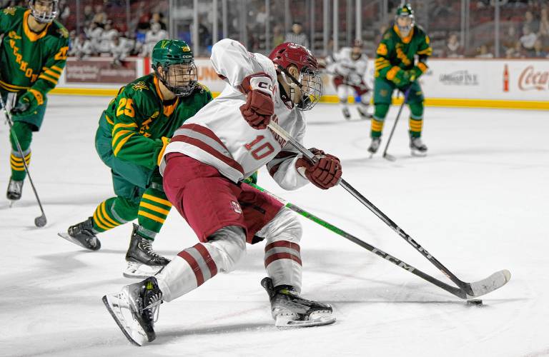 UMass freshman Dans Locmelis (10) skates deep into the Vermont zone during the Minutemen’s 4-1 Hockey East victory on Friday at the Mullins Center in Amherst.
