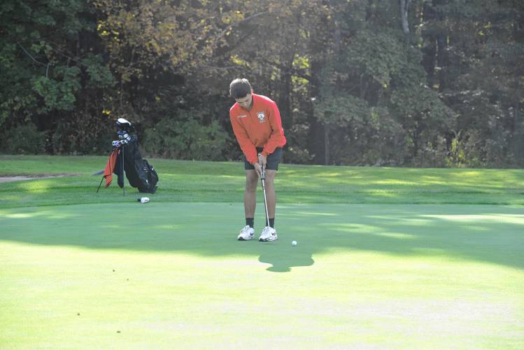 Athol’s Dominik St. Andre putts on Hole No. 2 during a match against Greenfield at the Country Club of Greenfield on Wednesday.