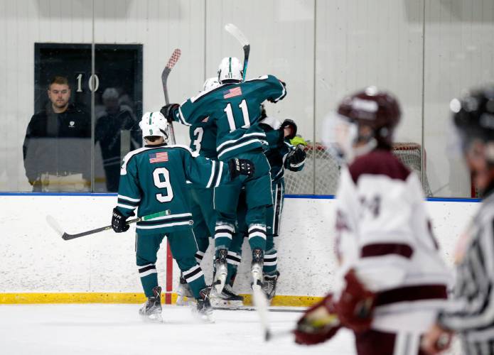 Greenfield celebrates after scoring a goal against Easthampton in the first period last season at Lossone Rink in Easthampton.