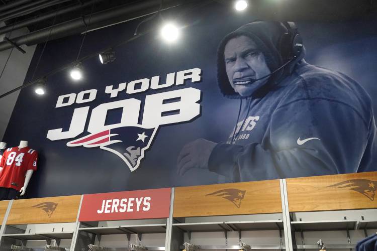 A mural with a likeness of New England Patriots head coach Bill Belichick is featured on a wall, Thursday, Jan. 11, 2024, at the Patriots ProShop in Foxborough, Mass. Six-time NFL champion Bill Belichick has agreed to part ways as the coach of the New England Patriots on Thursday, bringing an end to his 24-year tenure as the architect of the most decorated dynasty of the league's Super Bowl era, a source told the Associated Press on the condition of anonymity because it has not yet...